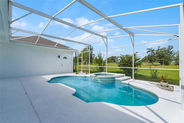 view of swimming pool with a lanai, an in ground hot tub, and a patio