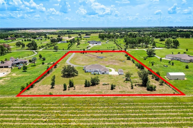 birds eye view of property featuring a rural view