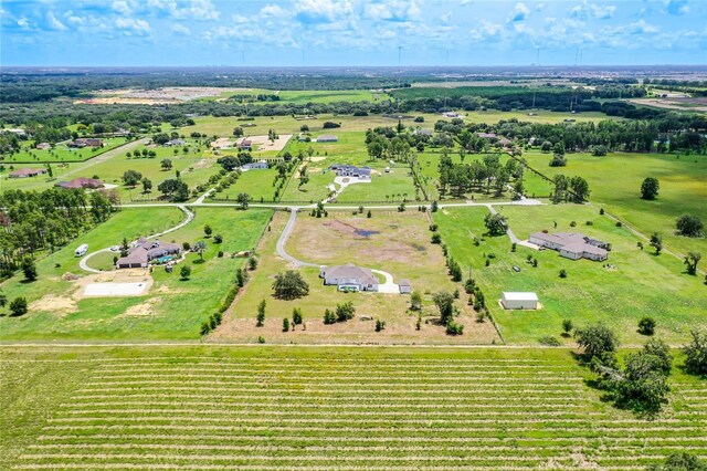 birds eye view of property featuring a rural view