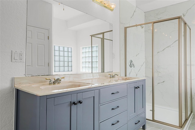 bathroom with vanity and walk in shower