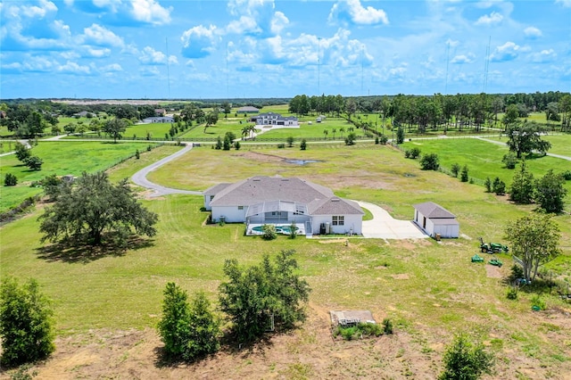 birds eye view of property with a rural view