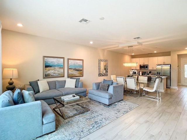 living room with light hardwood / wood-style floors