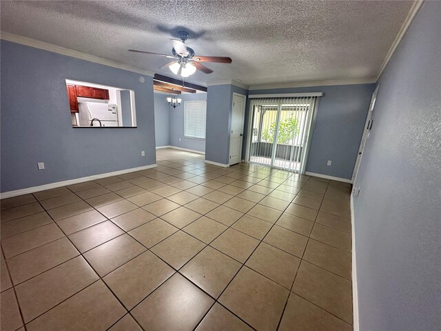 unfurnished room with ornamental molding, a textured ceiling, ceiling fan, and tile patterned flooring