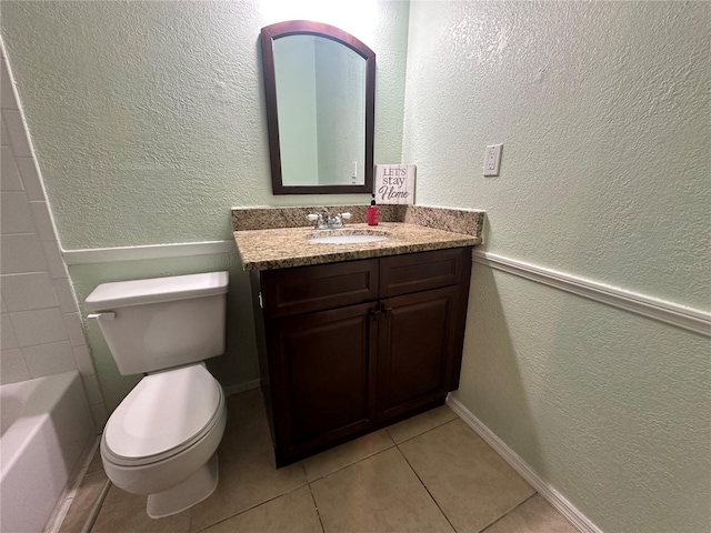 full bathroom with vanity, toilet, tile patterned floors, and shower / bathtub combination