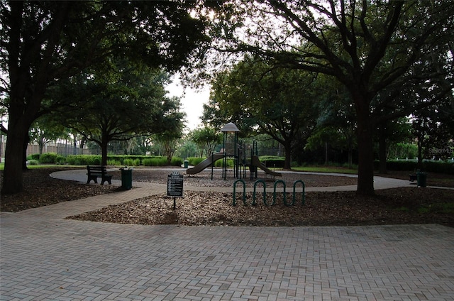 view of property's community with a playground