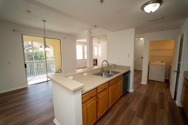 kitchen featuring black dishwasher, an inviting chandelier, sink, hanging light fixtures, and dark wood-type flooring