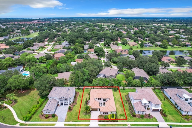 10193 Brocksport Cir, Gotha, FL 34734 - aerial perspective of suburban area featuring property parcel outlined and a large body of water