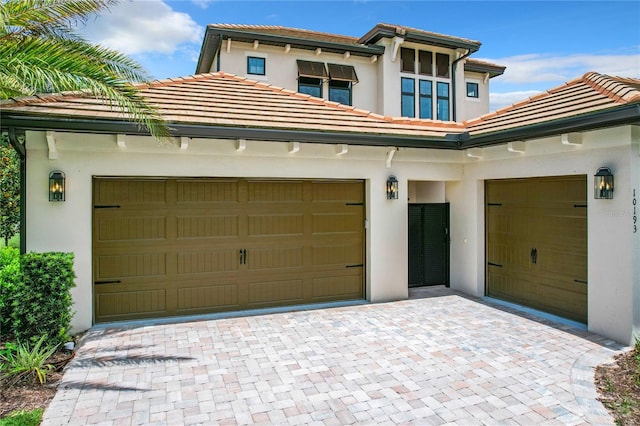 10193 Brocksport Cir, Gotha, FL 34734 - garage featuring decorative driveway