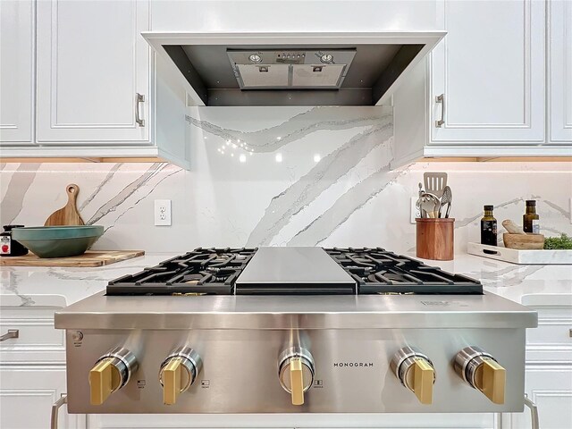 10193 Brocksport Cir, Gotha, FL 34734 - kitchen with extractor fan, white cabinetry, decorative backsplash, and stove