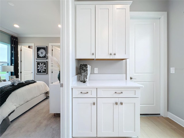 10193 Brocksport Cir, Gotha, FL 34734 - bedroom with crown molding and light wood-style flooring