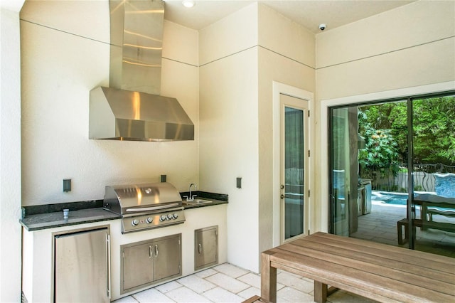 10193 Brocksport Cir, Gotha, FL 34734 - kitchen with fridge, wall chimney range hood, and dark countertops