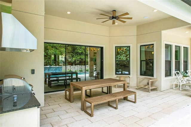 view of patio / terrace with area for grilling and ceiling fan