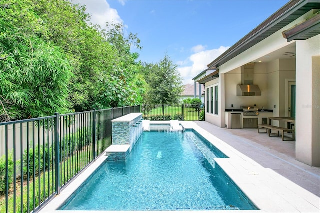 view of swimming pool featuring a patio area, pool water feature, and area for grilling