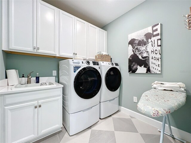 10193 Brocksport Cir, Gotha, FL 34734 - laundry area featuring cabinet space and independent washer and dryer