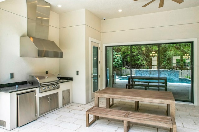 10193 Brocksport Cir, Gotha, FL 34734 - kitchen featuring wall chimney exhaust hood, fridge, a ceiling fan, dark countertops, and recessed lighting