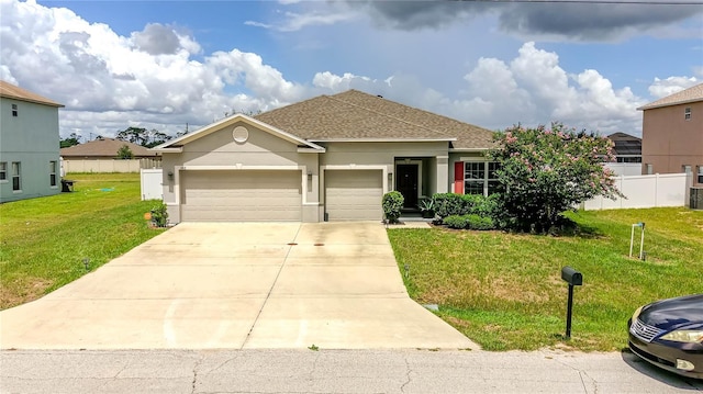 view of front facade featuring a garage and a front lawn