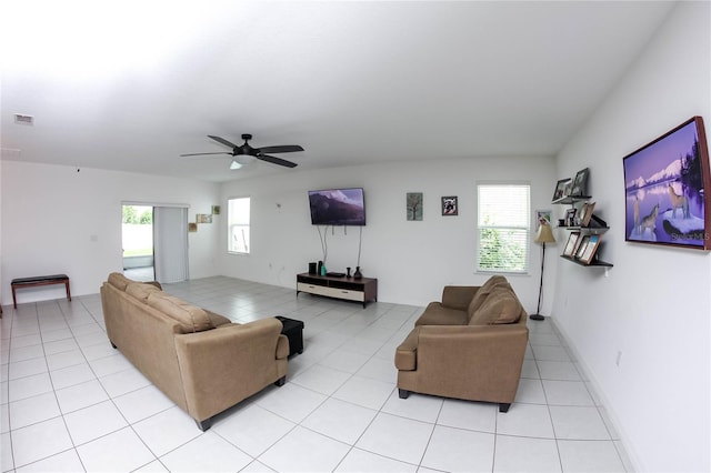 living room featuring light tile patterned floors and ceiling fan