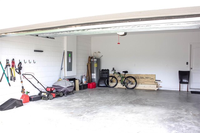 garage featuring electric panel and electric water heater