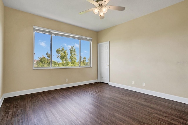 unfurnished room with dark wood-type flooring and ceiling fan