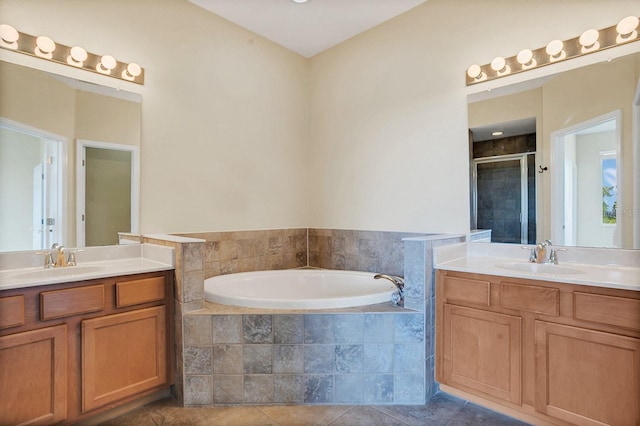 bathroom with vanity, independent shower and bath, and tile patterned flooring