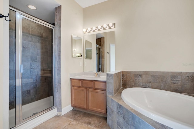 bathroom with vanity, tile patterned floors, and independent shower and bath