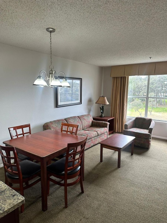 dining room with a notable chandelier, carpet floors, and a textured ceiling