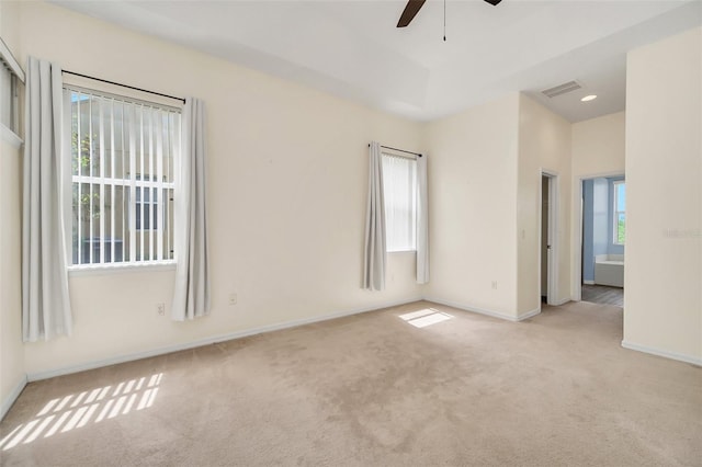 unfurnished room featuring ceiling fan and light colored carpet