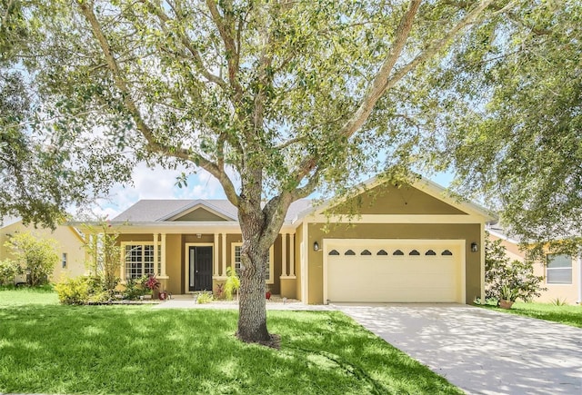 ranch-style home with a garage and a front yard