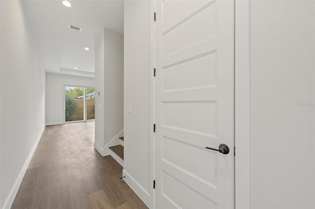 corridor featuring hardwood / wood-style floors