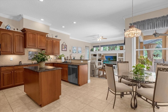 kitchen featuring dishwasher, a kitchen island, a wealth of natural light, and pendant lighting