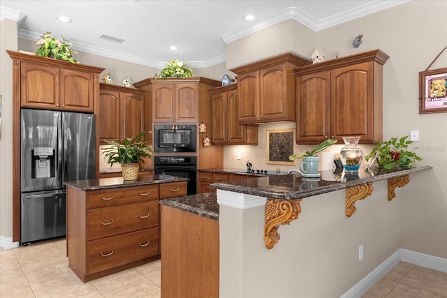 kitchen featuring ornamental molding, dark stone countertops, kitchen peninsula, and black appliances