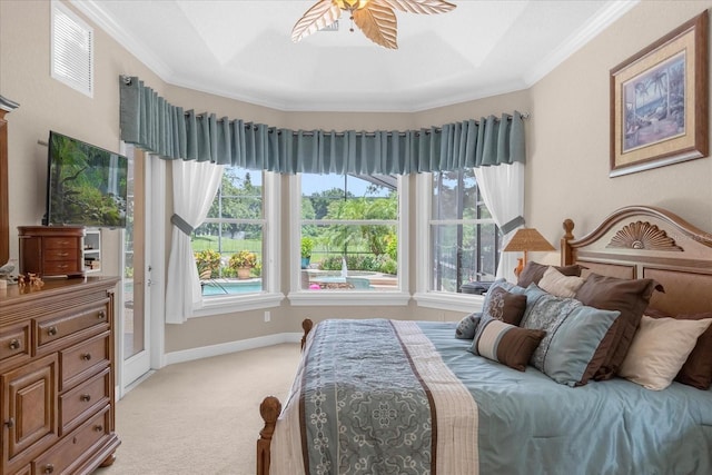 bedroom featuring multiple windows, ornamental molding, and light carpet