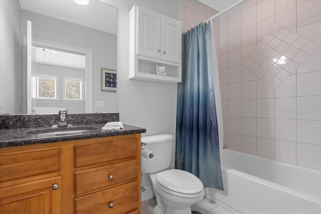 full bathroom featuring vanity, toilet, and shower / tub combo