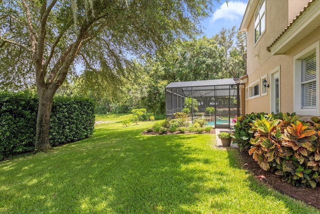 view of yard featuring glass enclosure