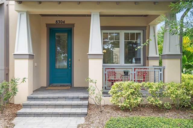 entrance to property with covered porch