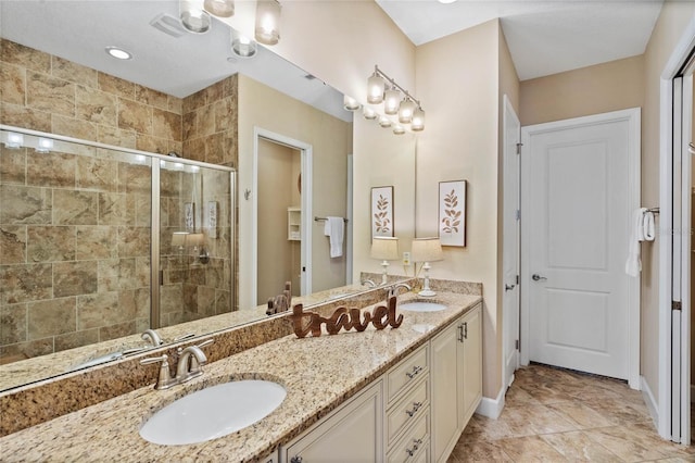 bathroom featuring vanity and a shower with shower door