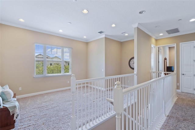 corridor featuring light colored carpet and ornamental molding