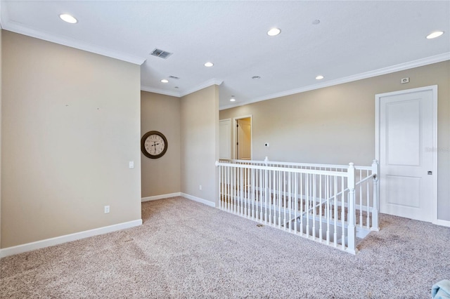 spare room featuring carpet floors and ornamental molding