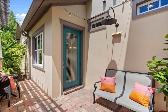 entrance to property featuring a patio