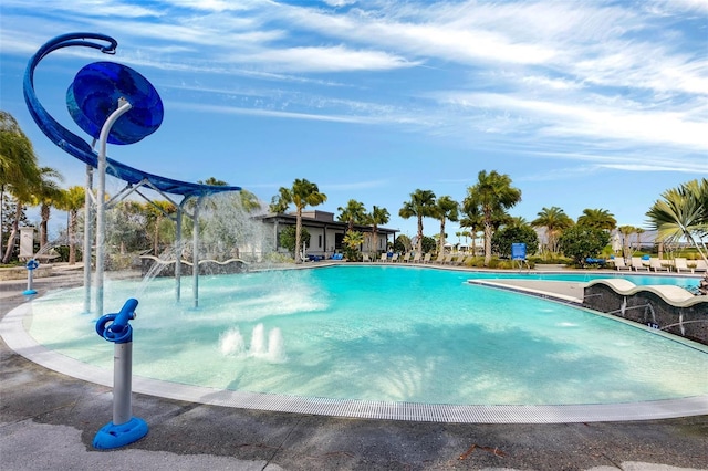 view of pool with pool water feature