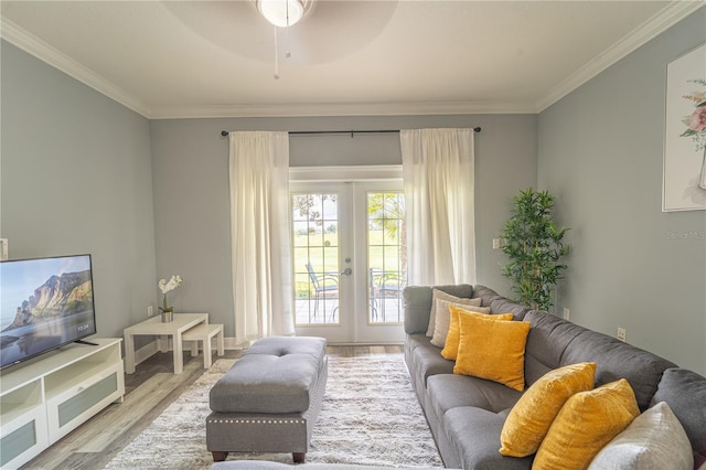 living room with light hardwood / wood-style flooring, ornamental molding, french doors, and ceiling fan