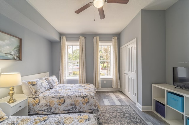 bedroom featuring light hardwood / wood-style floors, a closet, and ceiling fan