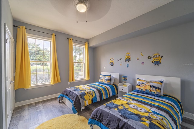 bedroom with ceiling fan and hardwood / wood-style floors