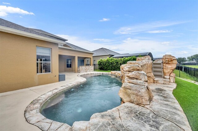 view of pool featuring a patio