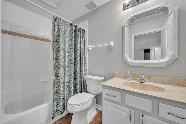 full bathroom featuring a textured ceiling, vanity, shower / bath combo with shower curtain, tile patterned flooring, and toilet