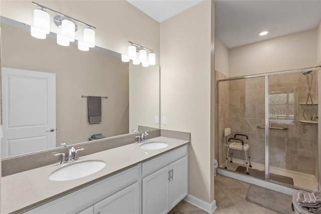 bathroom with vanity, tile patterned floors, toilet, and walk in shower