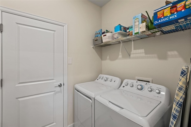 washroom with washing machine and dryer