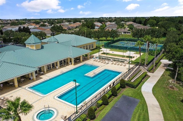 view of pool featuring a patio area and a hot tub