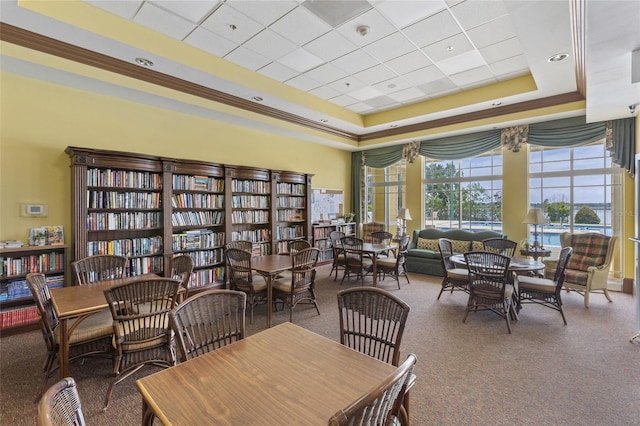 dining space featuring a tray ceiling