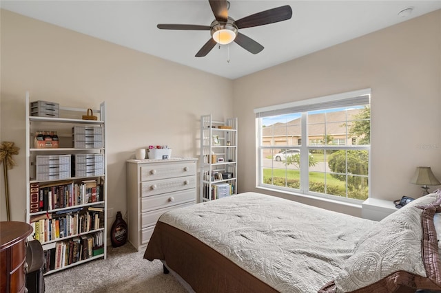 bedroom with ceiling fan and carpet floors